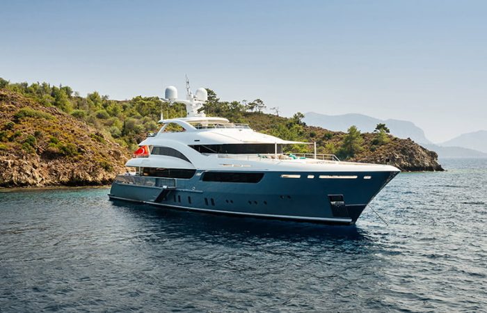 Luxury big yacht stay in the sea around the island on a background of the sky